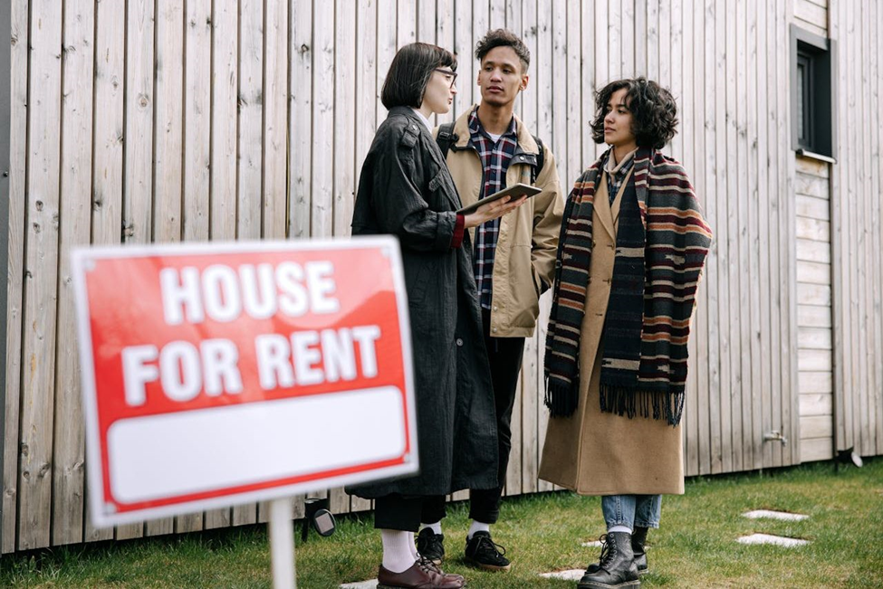 Couple talking to real estate agent